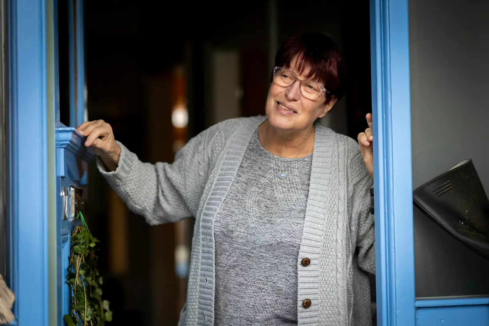 Homeowner welcoming a cleaner at the front door D&A Cleaning Ltd