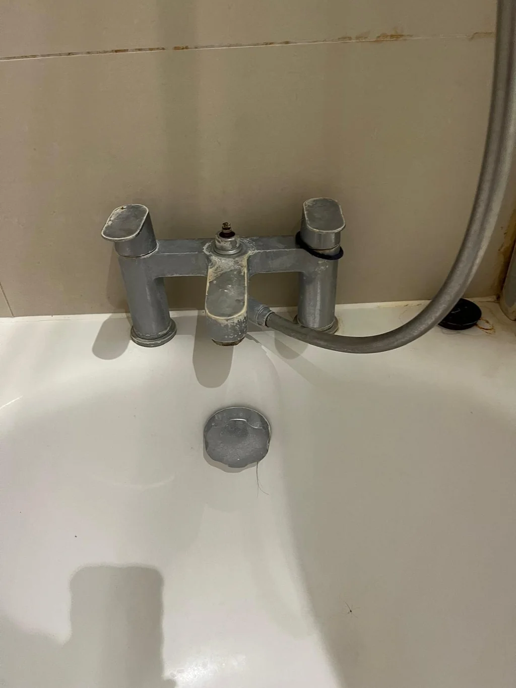Bath filler taps coated in limescale before move-in clean