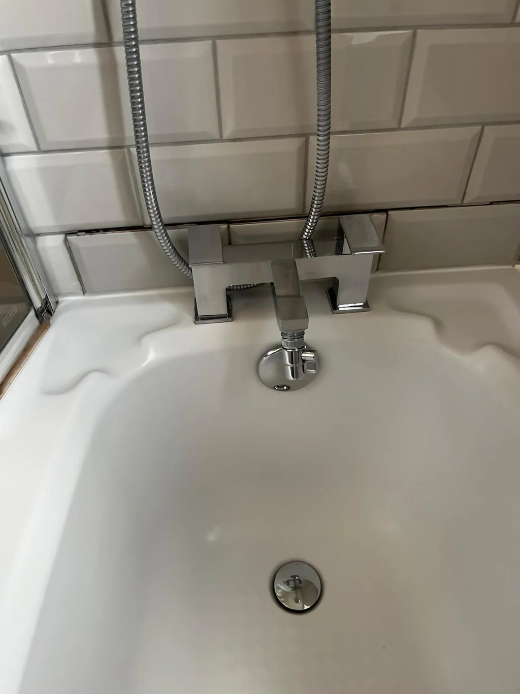 Chrome bath mixer taps polished after limescale removal