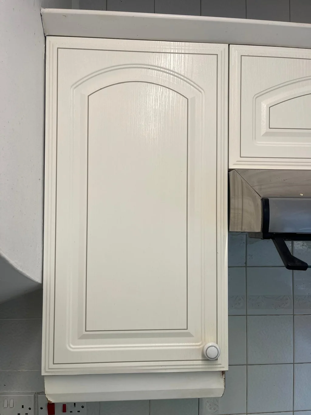White kitchen cupboard door bright and clean after degreasing