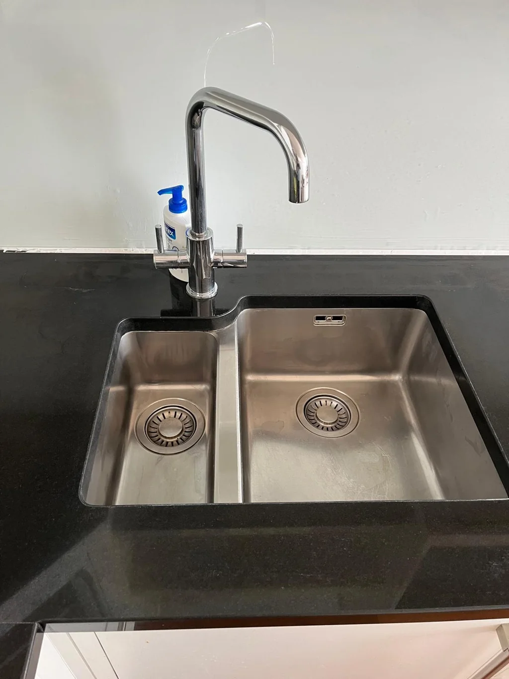 Stainless steel kitchen sink polished after a thorough clean D&A Cleaning Ltd Woodford