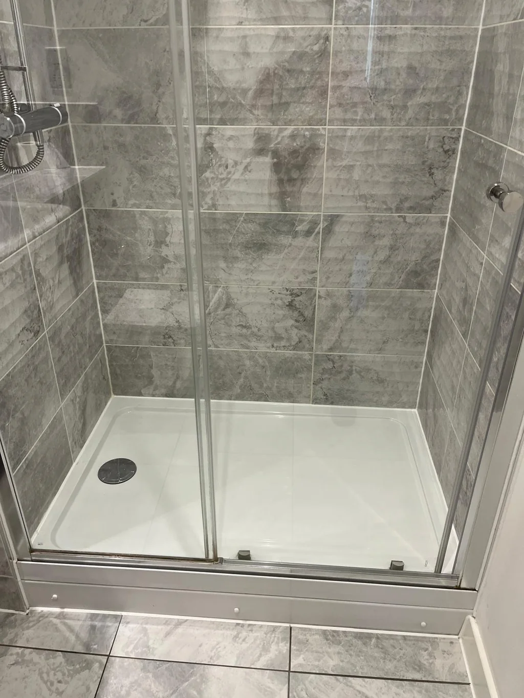 Glass shower enclosure crystal clear after a one-off clean D&A Cleaning Ltd