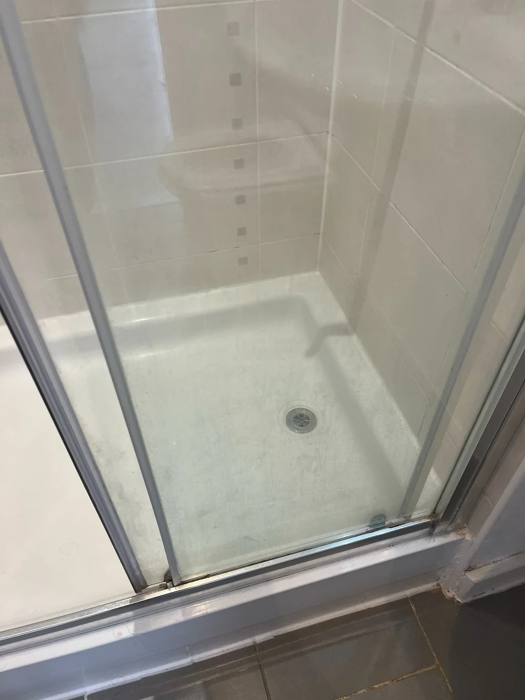 Sliding shower door clouded before regular domestic clean